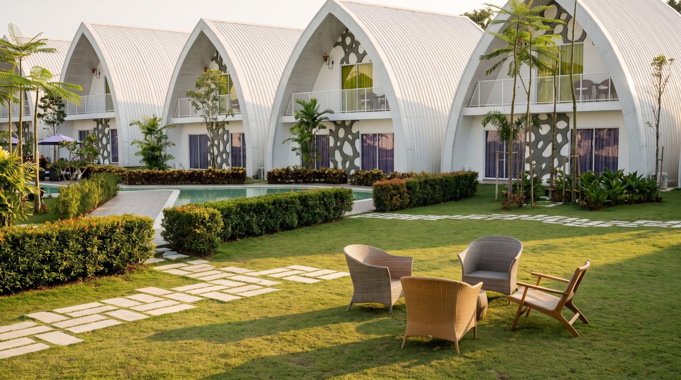 Garden seating in front of the arched pods at the Salus retreat in Cyberjaya